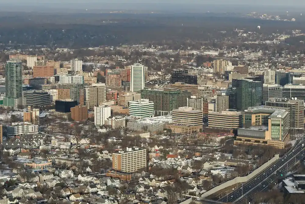 Aerial view of downtown Stamford, Connecticut, with office towers, nearby homes and a highway alongside